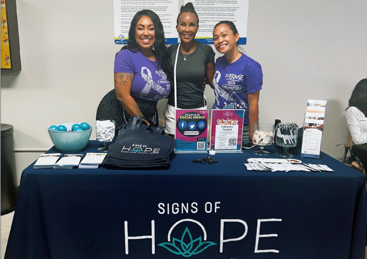 Signs of Hope staff and volunteers at events in LV